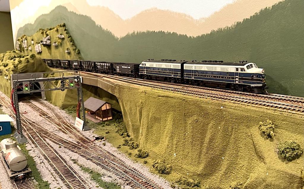 A hopper extra west barrels towards through the hills and coves of West Virginia returning empties to one of the mines (Mark Wallace photo)