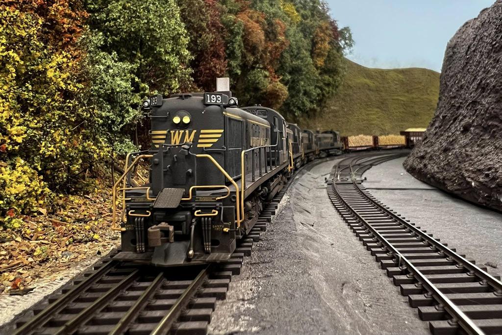 WM eastbound freight manifest Extra #193 has just left Elkins, WV Yard. It's the mid-1970s and this mixed freight of timber, freight, and coal powered by these aging RS-3s plus helpers will tackle the steep grade in Blackwater Canyon to Thomas  (Greg Shindledecker photo from Facebook)
